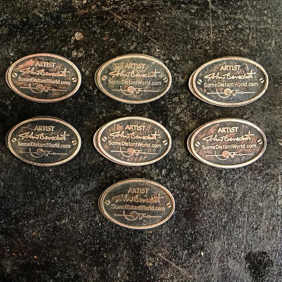 Oval maker's mark plates, each signed Artist John T. Benedict, SomeDistantWorld.com